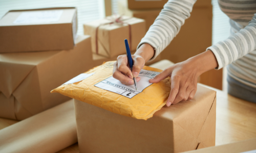 Woman taking receipt of shipped package